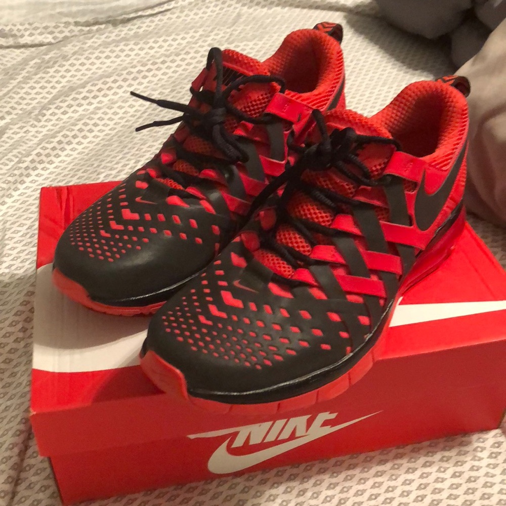 Red and black nike running shoes